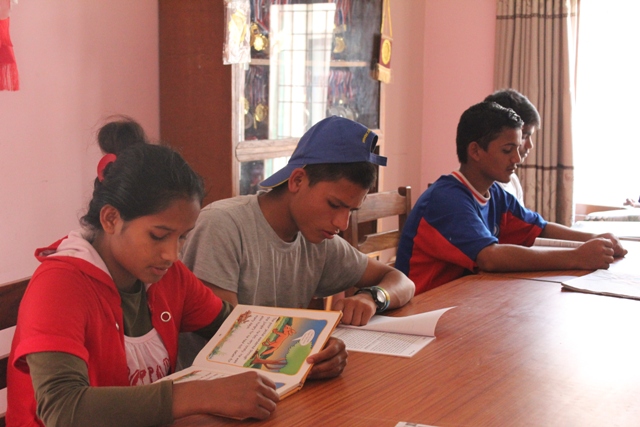 children studying in the liberary